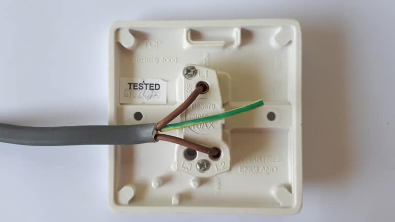 image of light switch with twin brown live cables