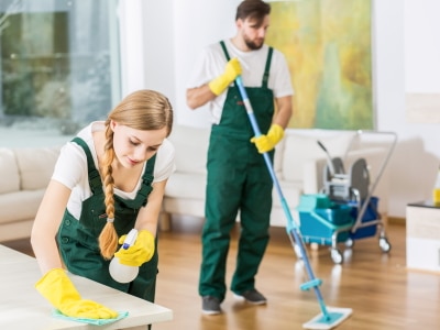 Image of two cleaners mopping floor