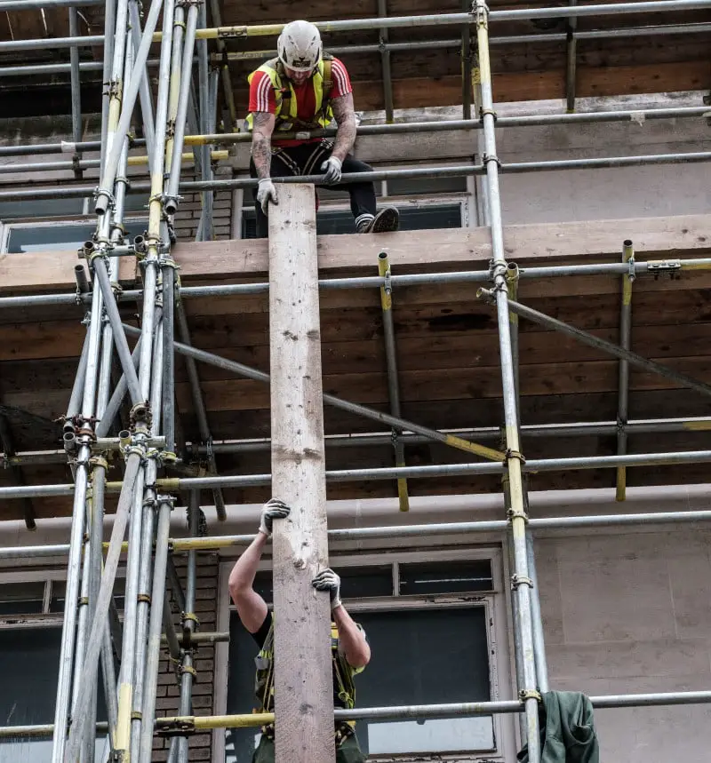 Trade people erecting scaffold