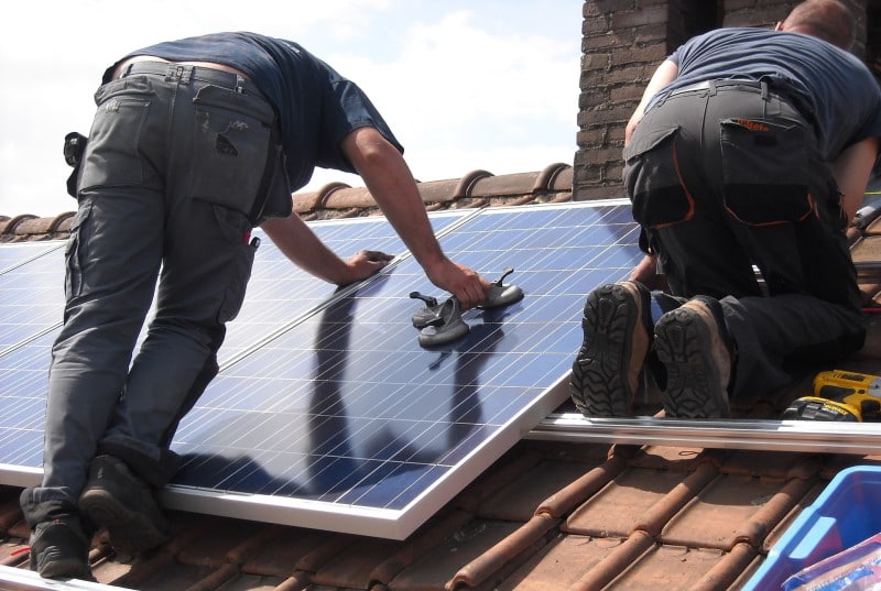 Image of two solar panel installers 